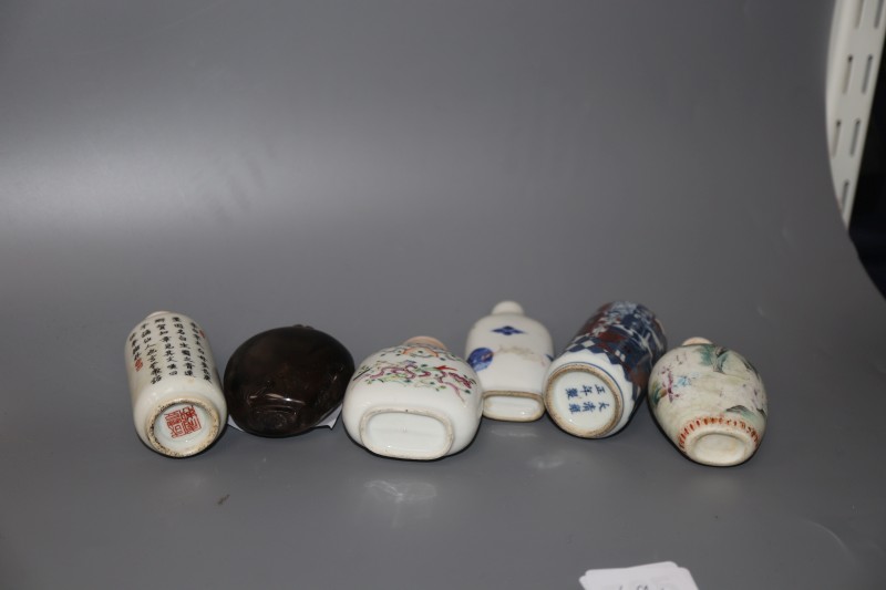 Five 19th century Chinese porcelain snuff bottles and a smoky quartz snuff bottle